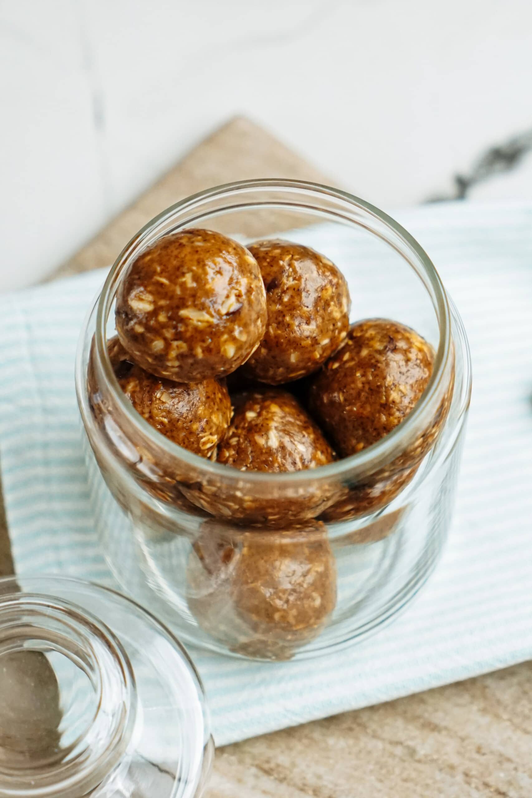 peanut butter energy balls stacked in a jar